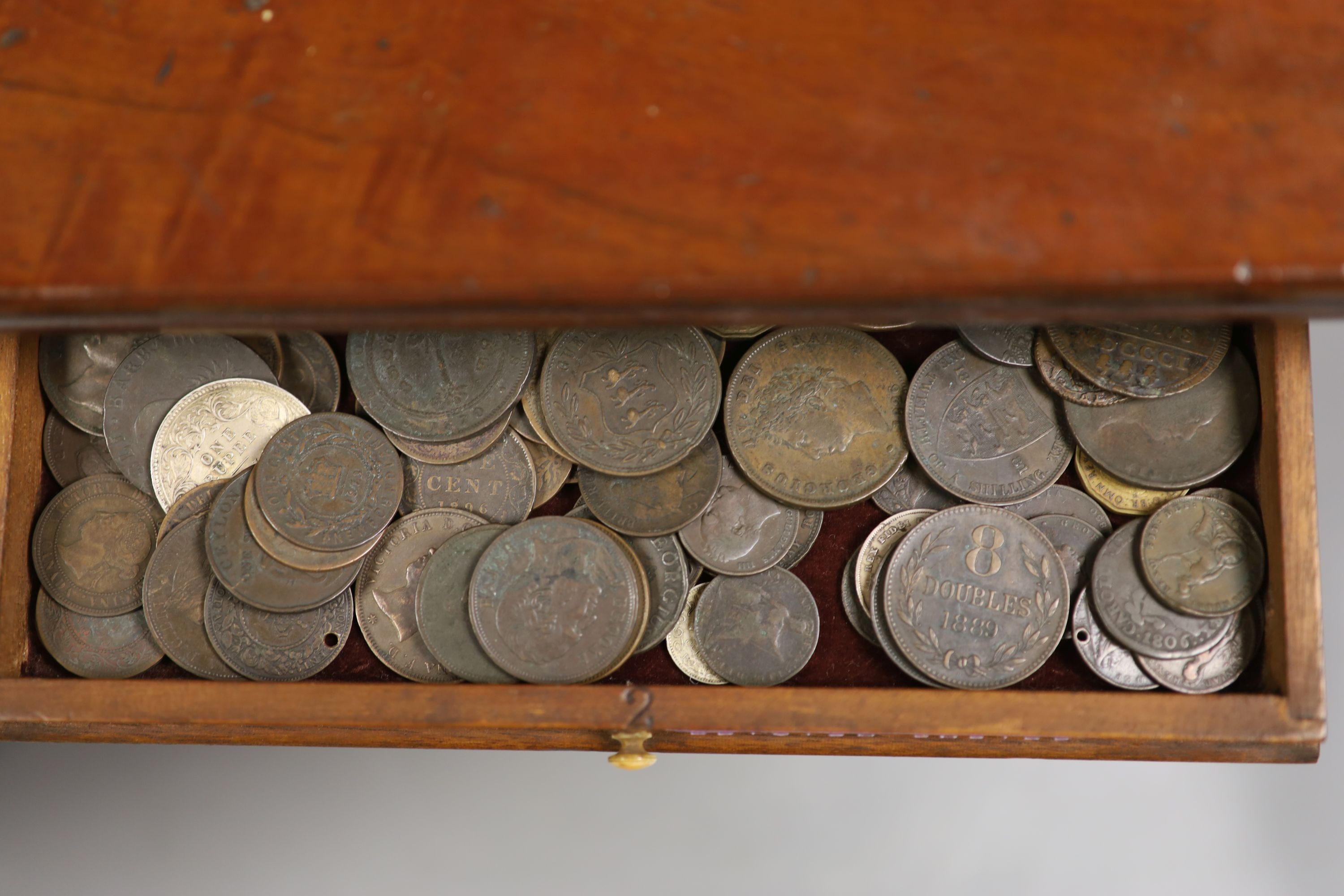 A mahogany coin collector's cabinet, fitted single door enclosing 10 drawers containing British and other coins (Georgian and later), tokens, etc.